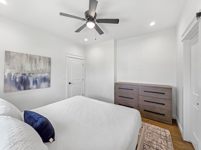 1025 Sunset Cir W, Crystal Beach, TX 77650 - bedroom with wood finished floors, recessed lighting, and ceiling fan