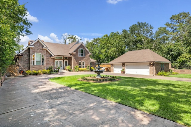 1917 Anchor Way, Dickinson, TX 77539 - view of front of property featuring french doors, brick siding, a front lawn, and a garage