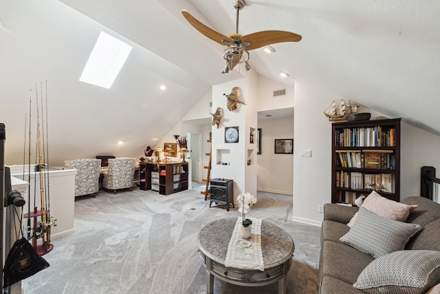 1917 Anchor Way, Dickinson, TX 77539 - living area featuring lofted ceiling, light carpet, baseboards, a skylight, and ceiling fan