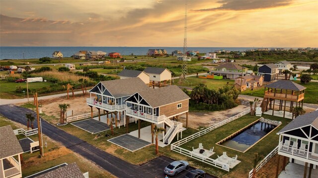 1025 Sunset Cir W, Crystal Beach, TX 77650 - aerial view at dusk of a water view