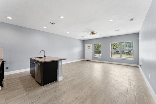 4534 Maggie St, Houston, TX 77051 - kitchen featuring a sink, ceiling fan, dishwasher, light wood-type flooring, and recessed lighting
