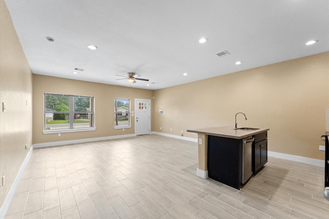 4534 Maggie St, Houston, TX 77051 - kitchen with a sink, ceiling fan, baseboards, and recessed lighting