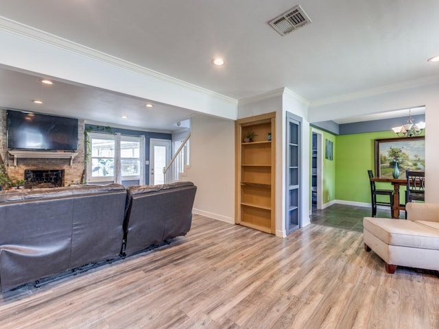 674 Ravensworth Dr, Conroe, TX 77302 - living area with baseboards, ornamental molding, wood finished floors, a chandelier, and recessed lighting