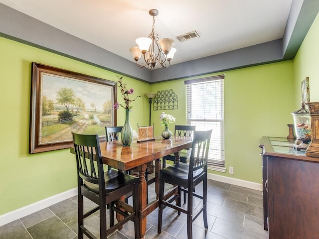674 Ravensworth Dr, Conroe, TX 77302 - dining space featuring a chandelier and baseboards