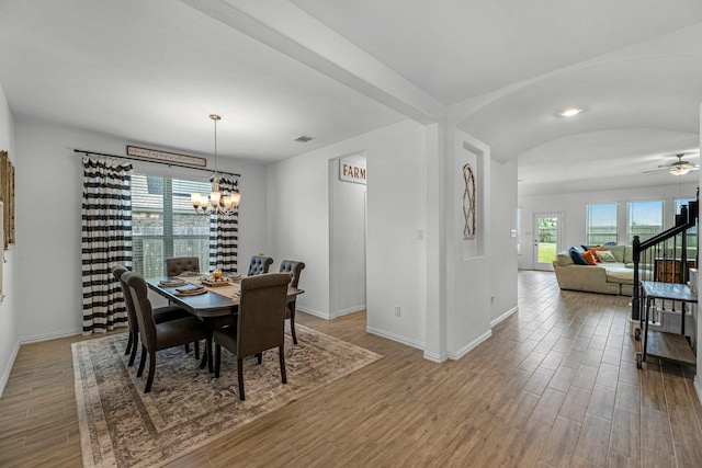 15010 Lake Shore Ave, Mont Belvieu, TX 77523 - dining room featuring a chandelier, baseboards, and wood finished floors