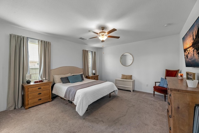 15010 Lake Shore Ave, Mont Belvieu, TX 77523 - bedroom featuring light colored carpet, ceiling fan, and baseboards