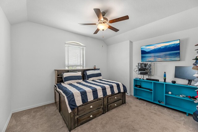 15010 Lake Shore Ave, Mont Belvieu, TX 77523 - carpeted bedroom with vaulted ceiling, a ceiling fan, and baseboards