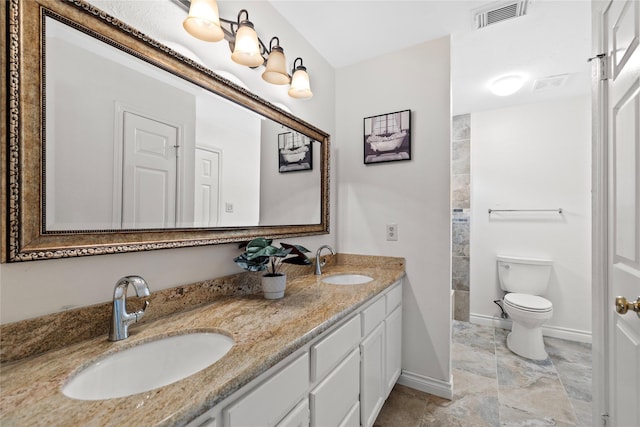 1711 Alcorn Bayou Dr, Sugar Land, TX 77479 - bathroom with double vanity, toilet, a tile shower, and baseboards