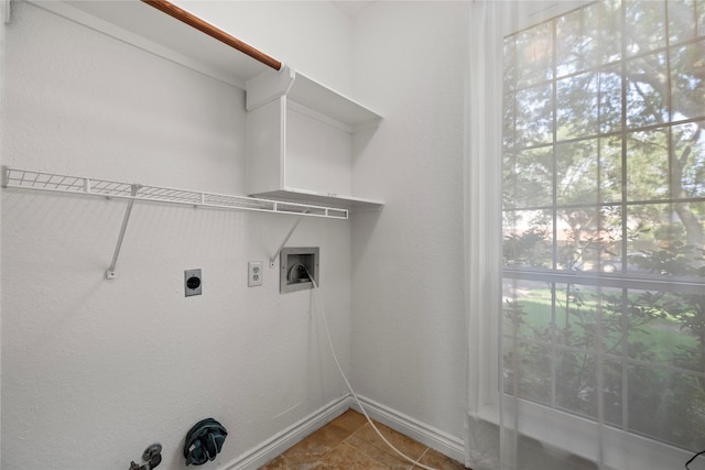 1711 Alcorn Bayou Dr, Sugar Land, TX 77479 - laundry area with electric dryer hookup, washer hookup, baseboards, and light tile patterned floors