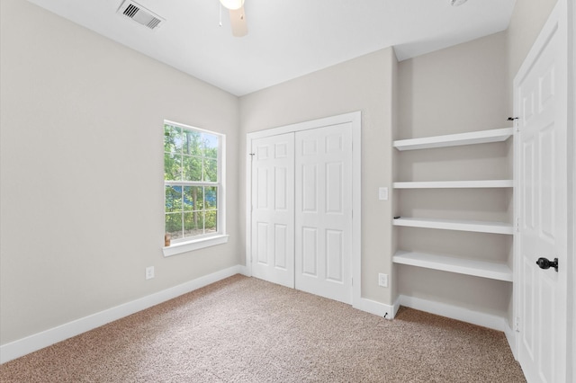 9303 Firnat St, Houston, TX 77016 - unfurnished bedroom featuring carpet floors, a closet, baseboards, and ceiling fan