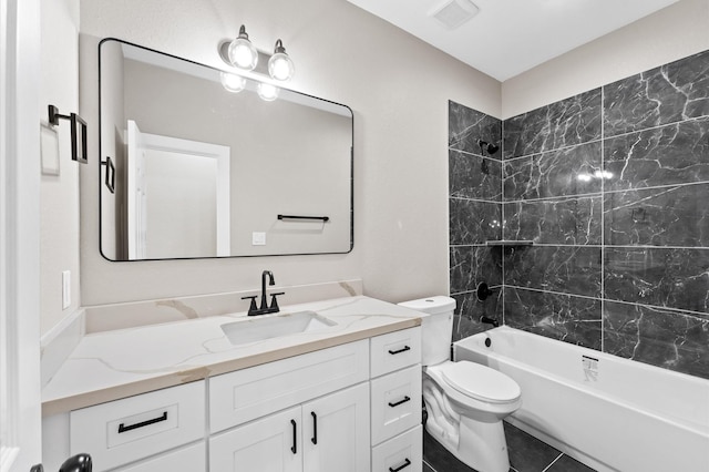 9303 Firnat St, Houston, TX 77016 - bathroom featuring vanity, shower / bath combination, toilet, and tile patterned floors