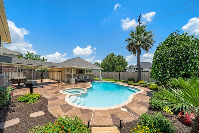 20306 Silverwood Trl, Cypress, TX 77433 - view of swimming pool featuring a patio area, a fenced backyard, a pool with connected hot tub, and grilling area