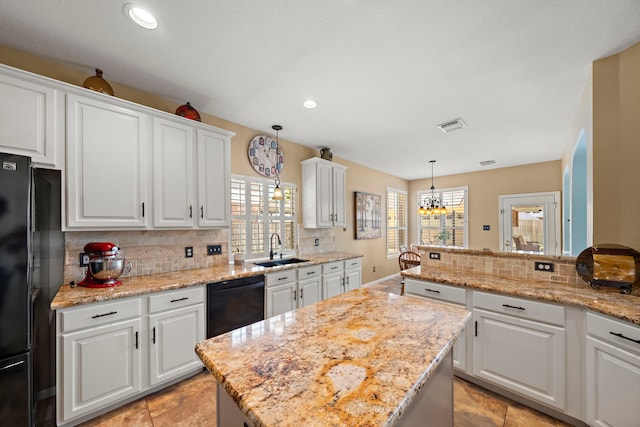 20306 Silverwood Trl, Cypress, TX 77433 - kitchen featuring black appliances, a sink, backsplash, white cabinets, and recessed lighting