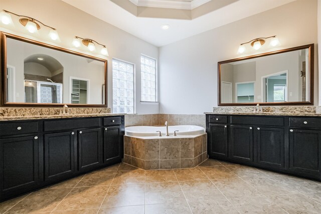 13918 Twisting Ivy Ln, Cypress, TX 77429 - bathroom with two vanities, a shower stall, a garden tub, crown molding, and tile patterned floors