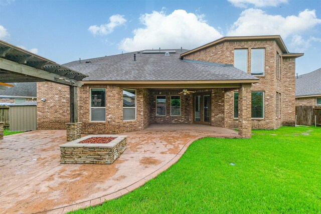 13918 Twisting Ivy Ln, Cypress, TX 77429 - rear view of house featuring roof with shingles, brick siding, a patio area, a fire pit, and a ceiling fan