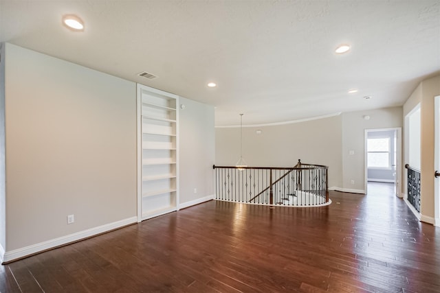 13918 Twisting Ivy Ln, Cypress, TX 77429 - spare room with baseboards, wood finished floors, built in shelves, and recessed lighting