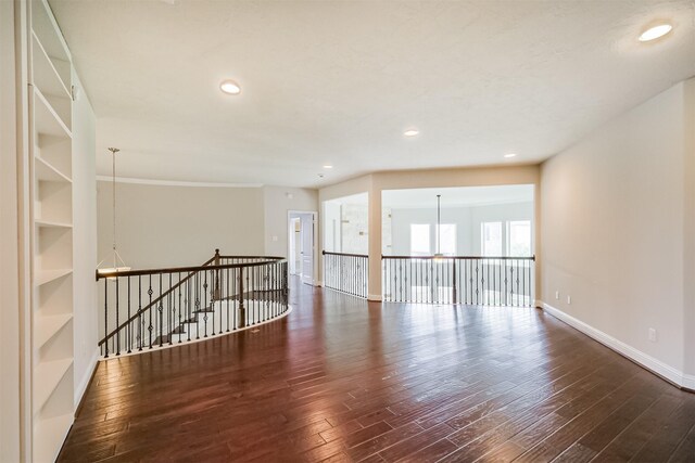 13918 Twisting Ivy Ln, Cypress, TX 77429 - spare room featuring wood finished floors, baseboards, recessed lighting, and built in features