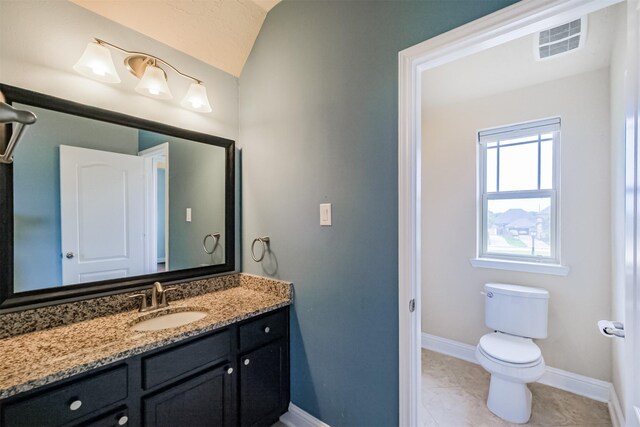 13918 Twisting Ivy Ln, Cypress, TX 77429 - bathroom featuring vanity, toilet, baseboards, and vaulted ceiling