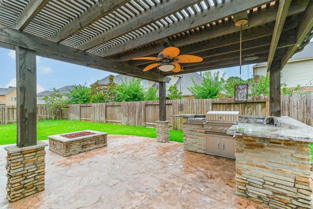 13918 Twisting Ivy Ln, Cypress, TX 77429 - view of patio with an outdoor fire pit
