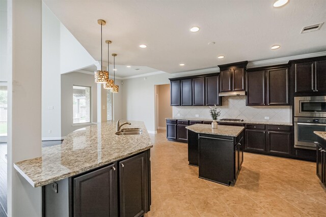 13918 Twisting Ivy Ln, Cypress, TX 77429 - kitchen with stainless steel appliances, a kitchen island with sink, crown molding, backsplash, and a sink