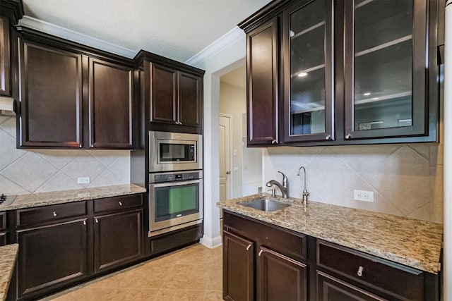 13918 Twisting Ivy Ln, Cypress, TX 77429 - kitchen featuring appliances with stainless steel finishes, a sink, ornamental molding, backsplash, and light stone countertops