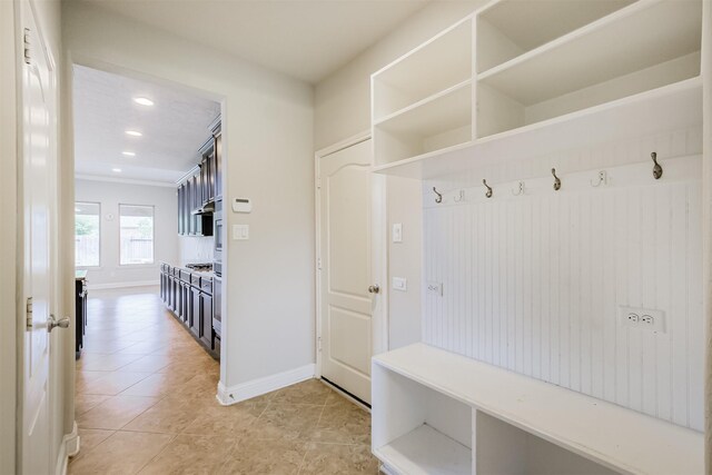 13918 Twisting Ivy Ln, Cypress, TX 77429 - mudroom featuring light tile patterned flooring, baseboards, recessed lighting, and ornamental molding