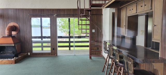 15088 Cozy Cove Ln, Willis, TX 77318 - doorway to outside with carpet floors and wood walls
