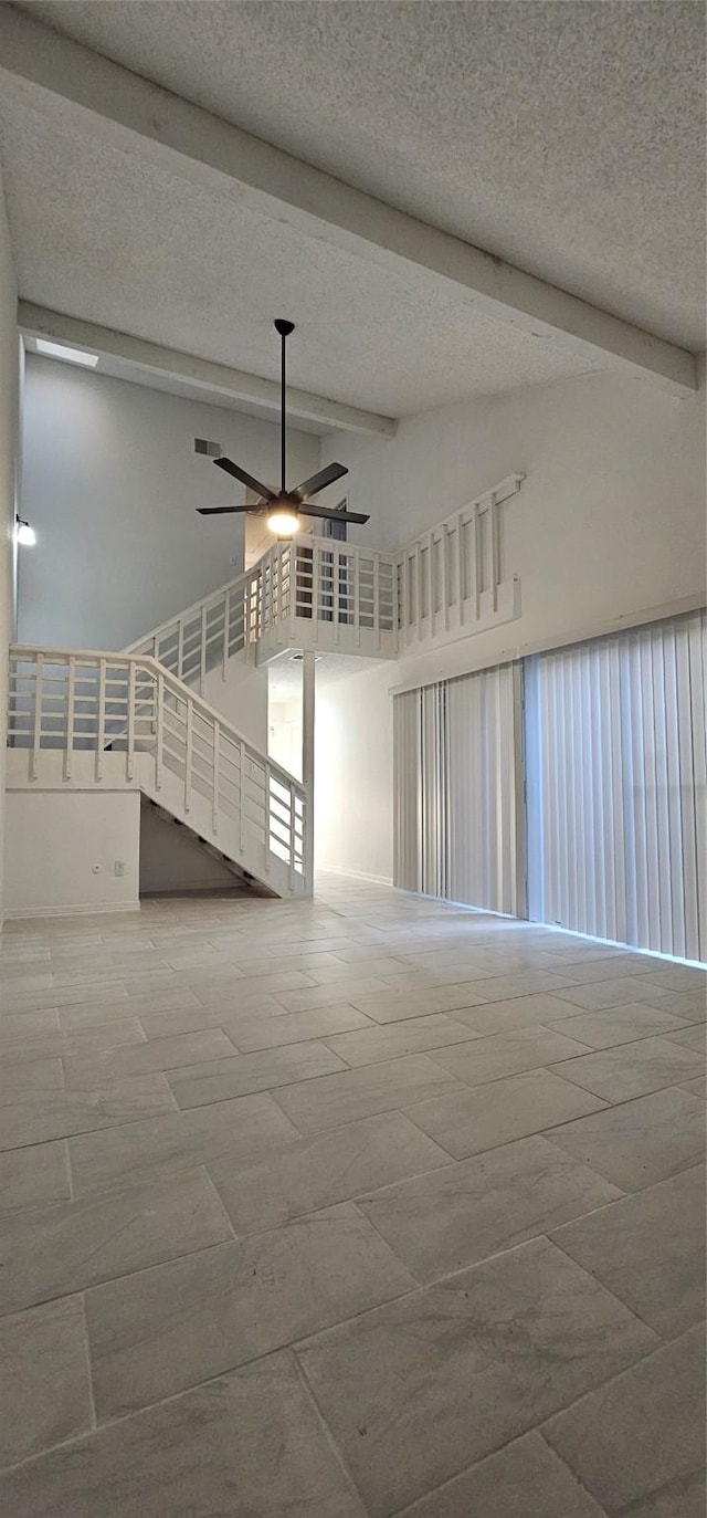 12819 Carvel Ln, Houston, TX 77072 - unfurnished room featuring beam ceiling, ceiling fan, high vaulted ceiling, and a textured ceiling