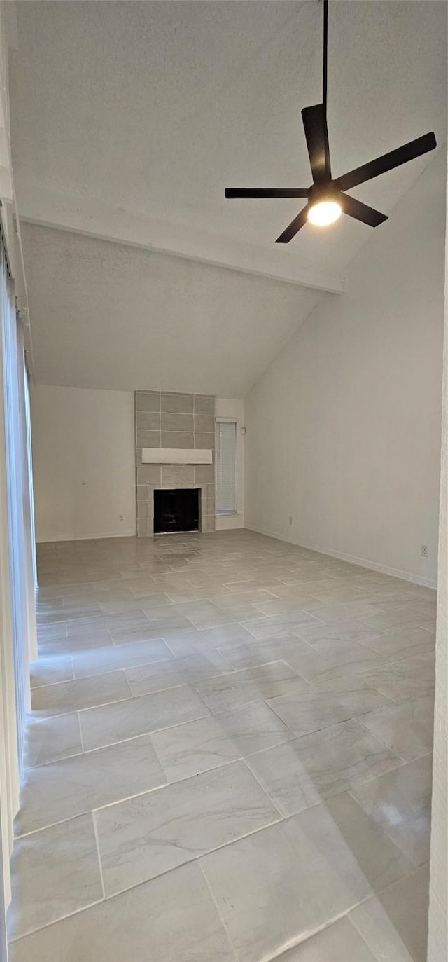 12819 Carvel Ln, Houston, TX 77072 - unfurnished living room with vaulted ceiling, ceiling fan, and a tiled fireplace