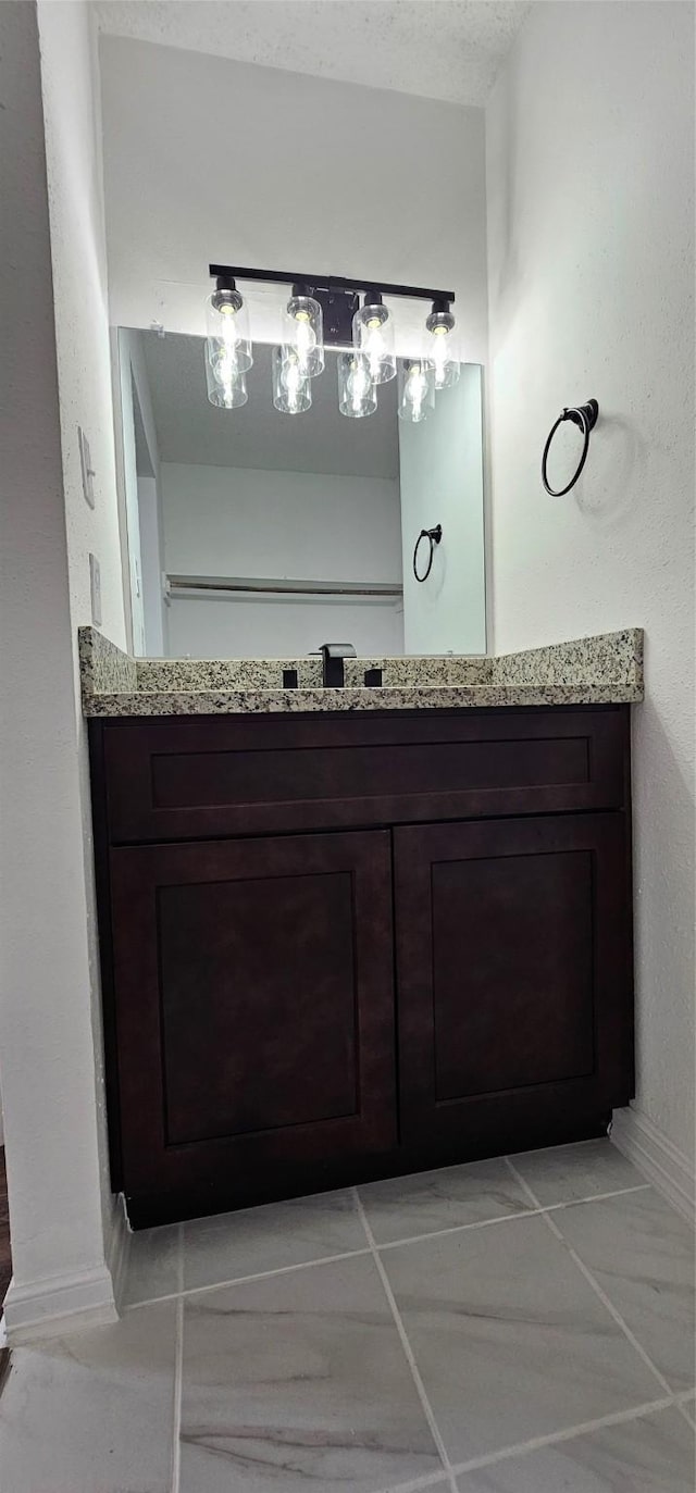 12819 Carvel Ln, Houston, TX 77072 - bathroom featuring vanity, baseboards, and tile patterned flooring