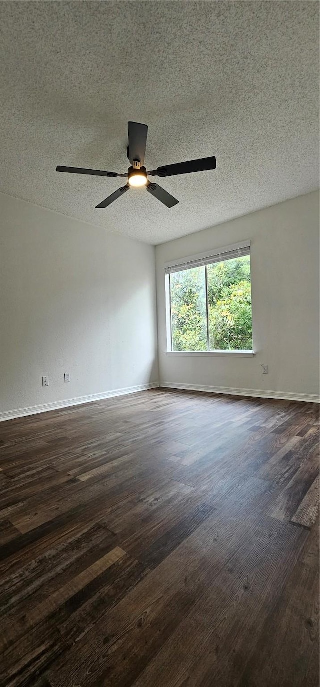 12819 Carvel Ln, Houston, TX 77072 - unfurnished room featuring dark wood-style floors, a textured ceiling, baseboards, and ceiling fan