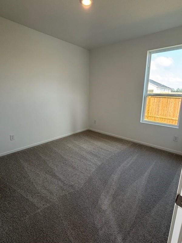 419 Robin St, Angleton, TX 77515 - spare room with dark carpet, baseboards, and recessed lighting