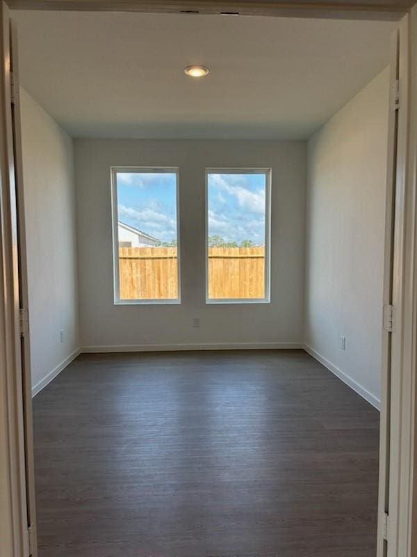 419 Robin St, Angleton, TX 77515 - empty room featuring dark wood-type flooring, baseboards, and recessed lighting