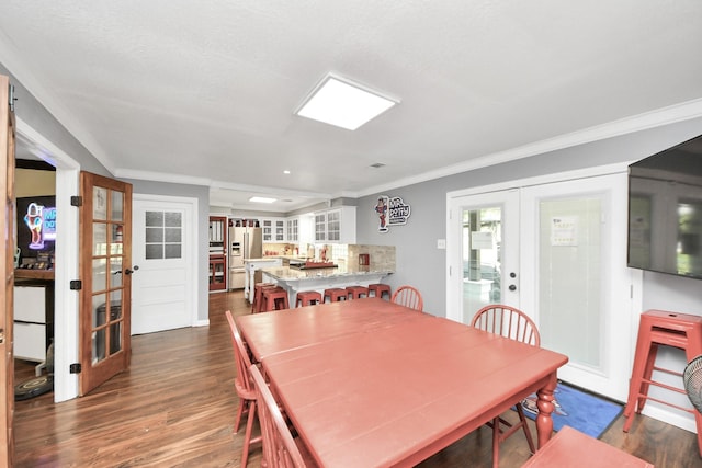 25203 Lakeview Rd, Katy, TX 77494 - dining area featuring french doors, dark wood-style floors, ornamental molding, and recessed lighting