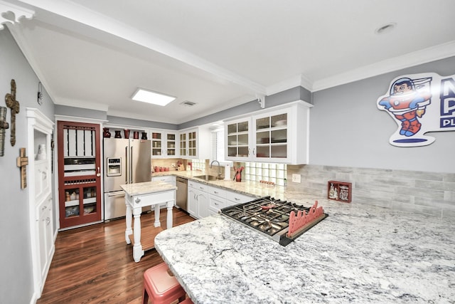 25203 Lakeview Rd, Katy, TX 77494 - kitchen with appliances with stainless steel finishes, a sink, dark wood finished floors, light stone countertops, and glass insert cabinets