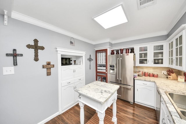25203 Lakeview Rd, Katy, TX 77494 - kitchen featuring stainless steel appliances, crown molding, dark wood-style flooring, white cabinets, and glass insert cabinets