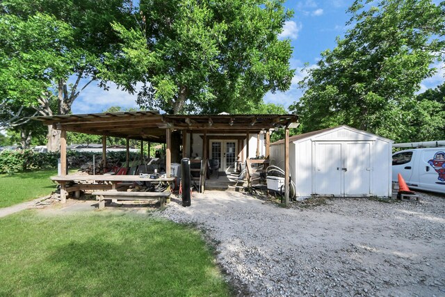 25203 Lakeview Rd, Katy, TX 77494 - view of grassy yard featuring french doors and a patio