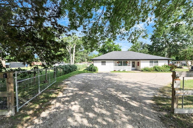 25203 Lakeview Rd, Katy, TX 77494 - view of home's exterior with driveway and a gate