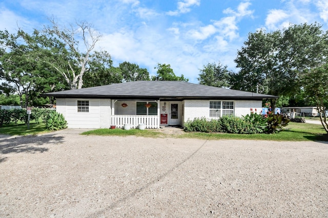 25203 Lakeview Rd, Katy, TX 77494 - view of front of property with covered porch, brick siding, and driveway