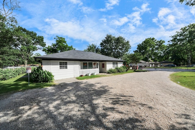 25203 Lakeview Rd, Katy, TX 77494 - view of front facade featuring covered porch, brick siding, and driveway