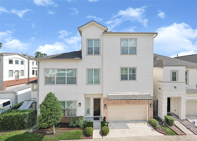 1210 Cedarpost Tree Springs Pl Unit P, Houston, TX 77055 - view of property with concrete driveway, an attached garage, brick siding, and stucco siding