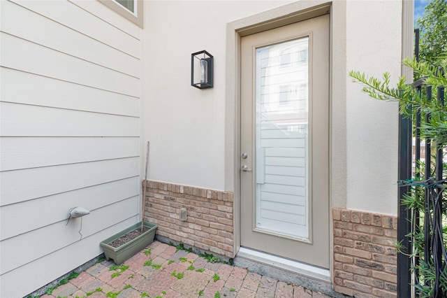 1210 Cedarpost Tree Springs Pl Unit P, Houston, TX 77055 - doorway to property featuring brick siding and stucco siding