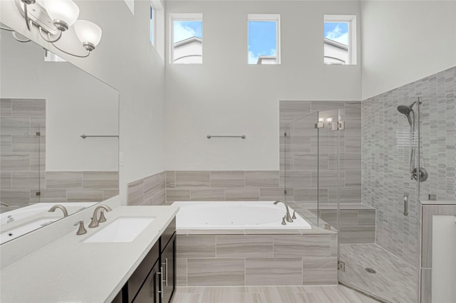 1210 Cedarpost Tree Springs Pl Unit P, Houston, TX 77055 - bathroom with a shower stall, vanity, a tub with jets, and plenty of natural light