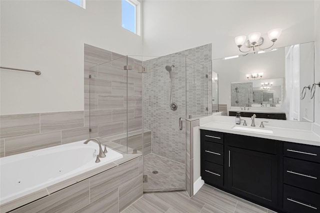 1210 Cedarpost Tree Springs Pl Unit P, Houston, TX 77055 - bathroom featuring a shower stall, a jetted tub, a chandelier, and vanity