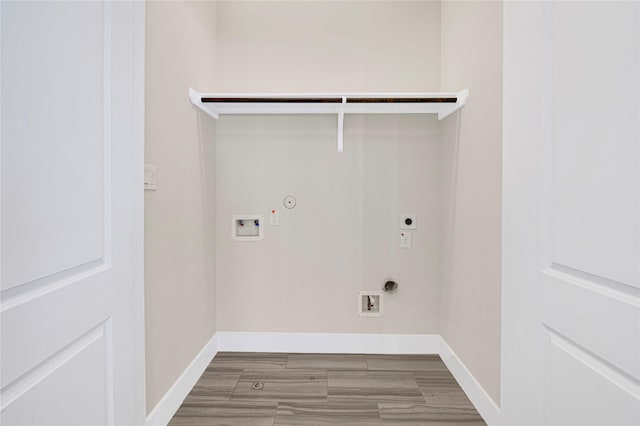 1210 Cedarpost Tree Springs Pl Unit P, Houston, TX 77055 - washroom with gas dryer hookup, hookup for an electric dryer, hookup for a washing machine, baseboards, and wood finished floors