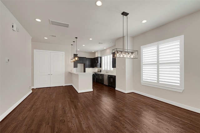 1210 Cedarpost Tree Springs Pl Unit P, Houston, TX 77055 - kitchen featuring light countertops, refrigerator, dark wood finished floors, baseboards, and recessed lighting