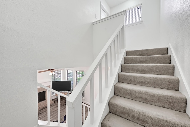 2211 S Kirkwood Rd Unit 26, Houston, TX 77077 - stairs featuring ceiling fan, plenty of natural light, and a textured wall