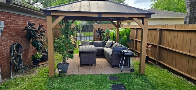 1 Lazy Ln, Bay City, TX 77414 - fenced backyard featuring a gazebo, outdoor lounge area, and a patio area