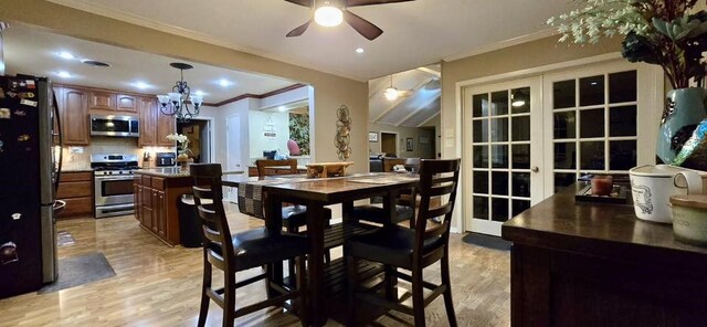 1 Lazy Ln, Bay City, TX 77414 - dining space with ornamental molding, light wood-style flooring, a ceiling fan, french doors, and recessed lighting