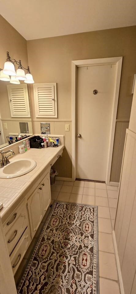 1 Lazy Ln, Bay City, TX 77414 - bathroom featuring vanity and tile patterned flooring